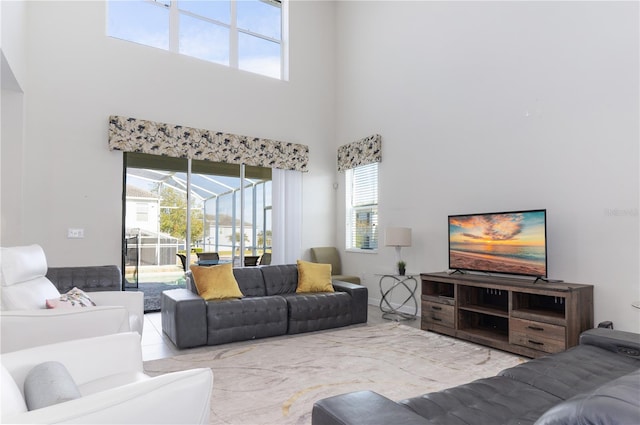 living room with a high ceiling