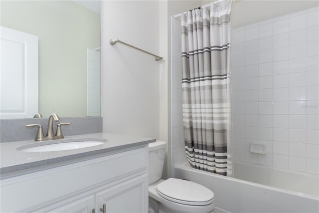 full bathroom featuring shower / bath combo, vanity, and toilet