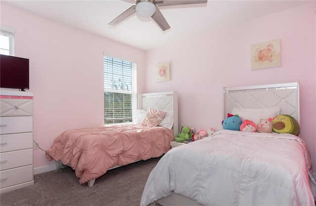 bedroom with carpet floors, multiple windows, and ceiling fan