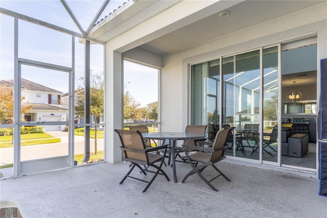 1593 Mulligan Blvd, Davenport, FL 33896 - sunroom with outdoor dining space and a chandelier