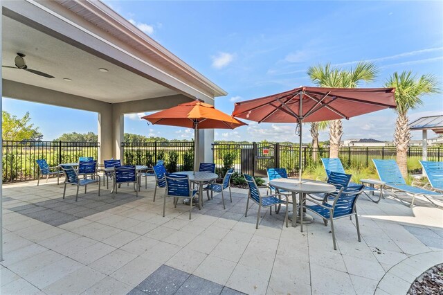 view of patio featuring ceiling fan