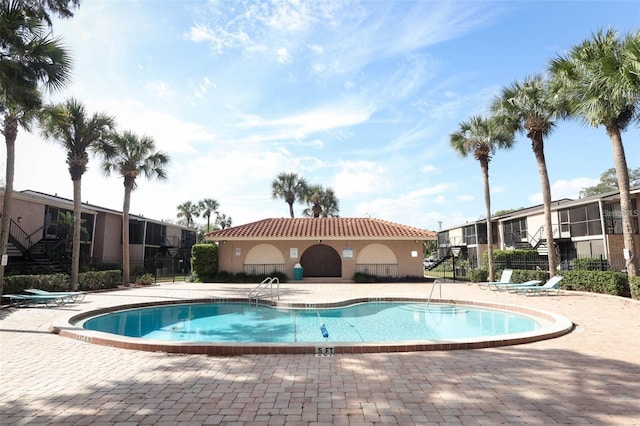 view of swimming pool featuring a patio