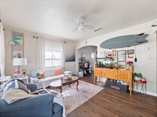 710 Spruce St, New Smyrna Beach, FL 32168 - living room with a ceiling fan, wood finished floors, and arched walkways