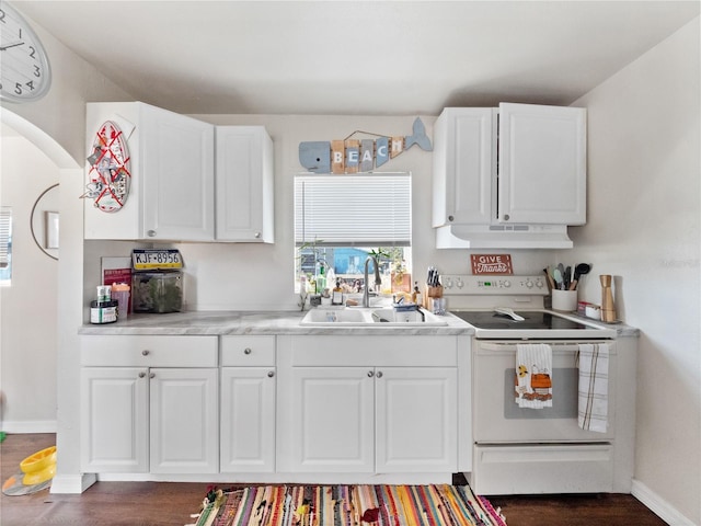 710 Spruce St, New Smyrna Beach, FL 32168 - kitchen featuring white electric range oven, a sink, under cabinet range hood, white cabinets, and light countertops