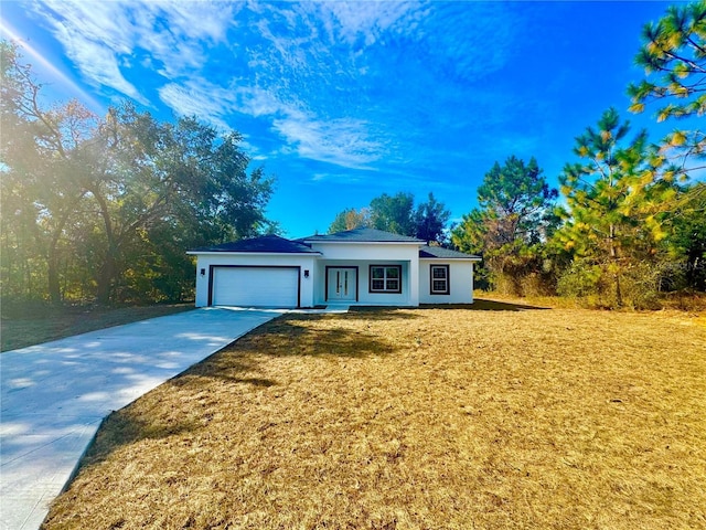 view of front facade featuring a garage and a front lawn