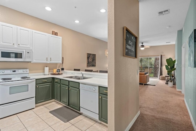 kitchen featuring ceiling fan, light colored carpet, white appliances, white cabinets, and green cabinetry