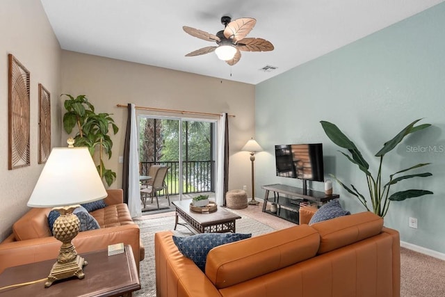 carpeted living room featuring ceiling fan