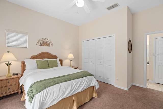 carpeted bedroom featuring a closet and ceiling fan