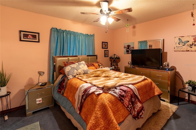 carpeted bedroom featuring ceiling fan and a textured ceiling