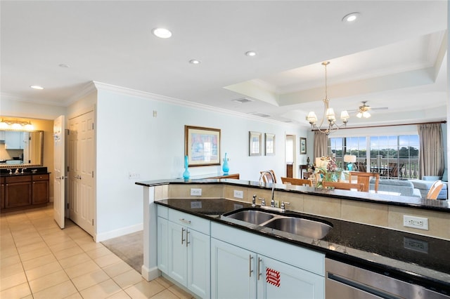 kitchen with ornamental molding, sink, pendant lighting, dark stone countertops, and dishwasher