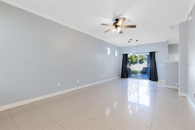 tiled spare room featuring ceiling fan