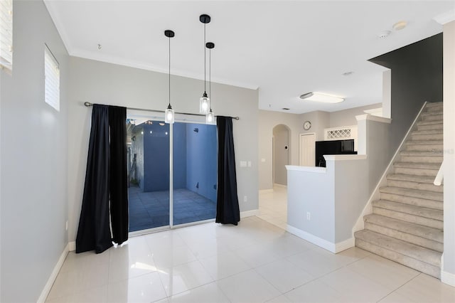 kitchen featuring light tile patterned floors, hanging light fixtures, and ornamental molding