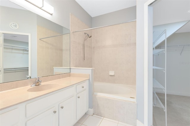 bathroom with tile patterned floors, vanity, and shower with separate bathtub