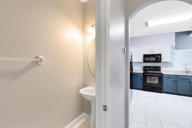 bathroom with tile patterned floors and sink