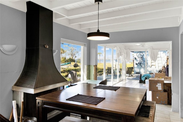 tiled dining area with ceiling fan, beamed ceiling, and wood ceiling