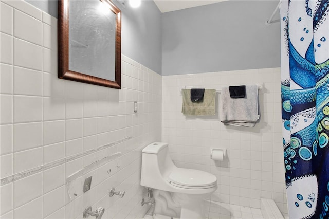 bathroom with a shower with shower curtain, tile walls, and toilet