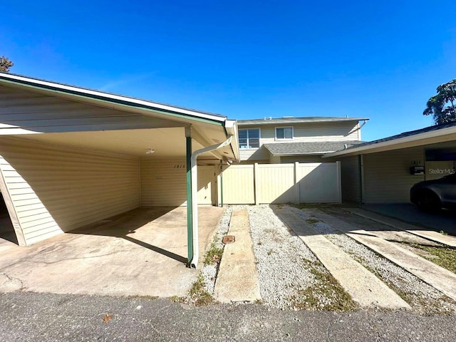 view of side of property with a carport