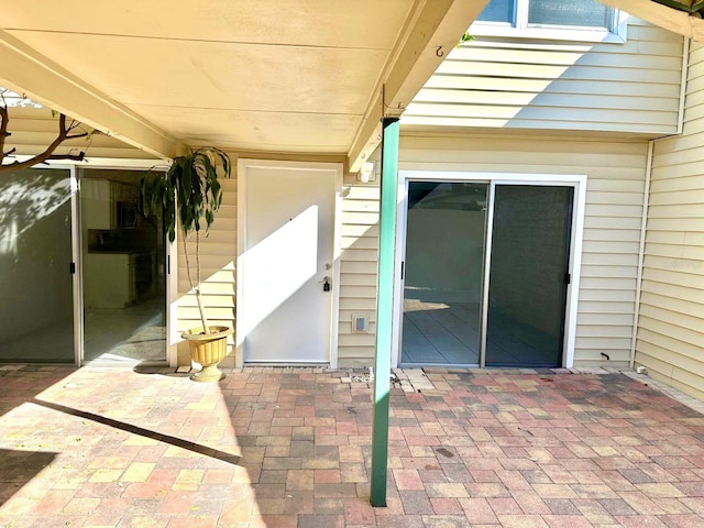 property entrance featuring a patio