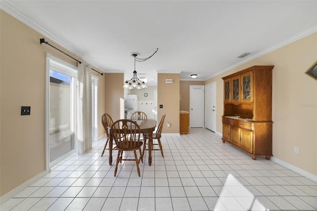 dining room with ornamental molding, light tile patterned floors, and a chandelier