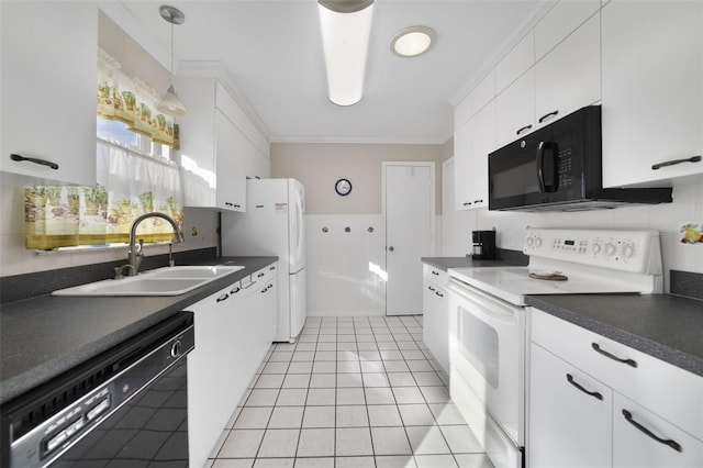 kitchen with black appliances, white cabinets, sink, light tile patterned floors, and decorative light fixtures