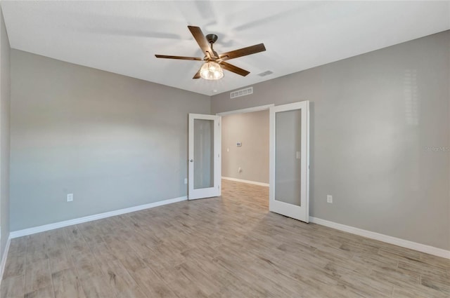 interior space featuring ceiling fan, light hardwood / wood-style floors, and french doors