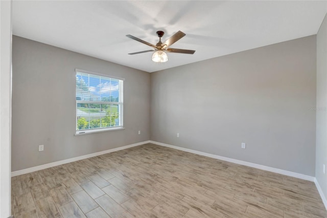 spare room with ceiling fan and light hardwood / wood-style floors