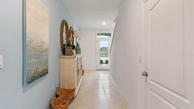 corridor featuring light tile patterned floors