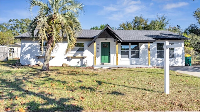 view of front of property with a front lawn