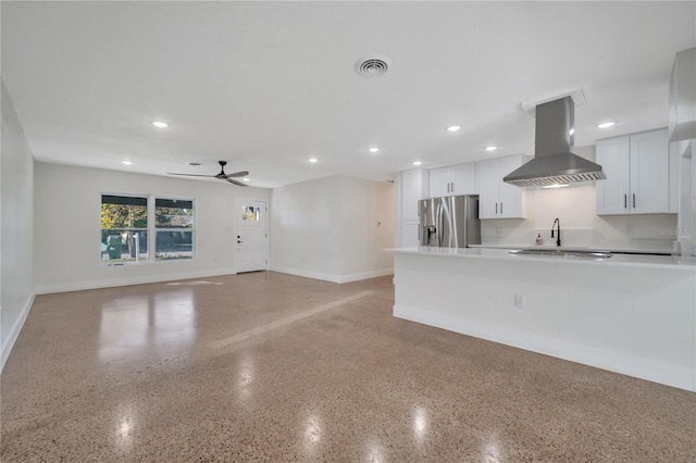 kitchen featuring white cabinetry, sink, ceiling fan, stainless steel fridge with ice dispenser, and exhaust hood