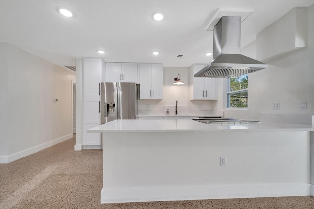 kitchen featuring kitchen peninsula, island range hood, sink, stainless steel fridge with ice dispenser, and white cabinetry