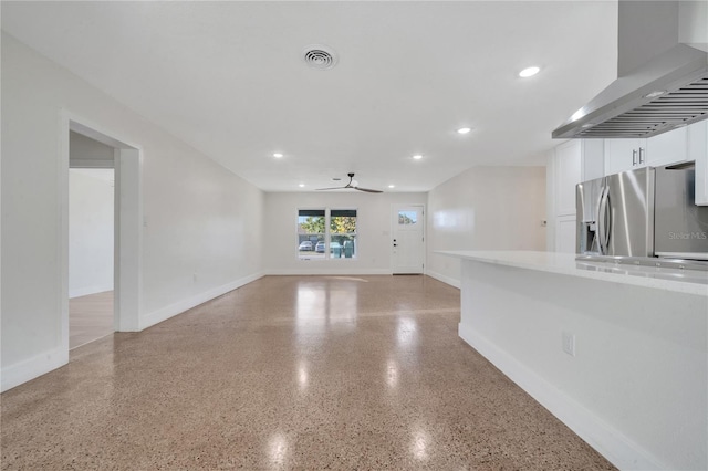 unfurnished living room featuring ceiling fan