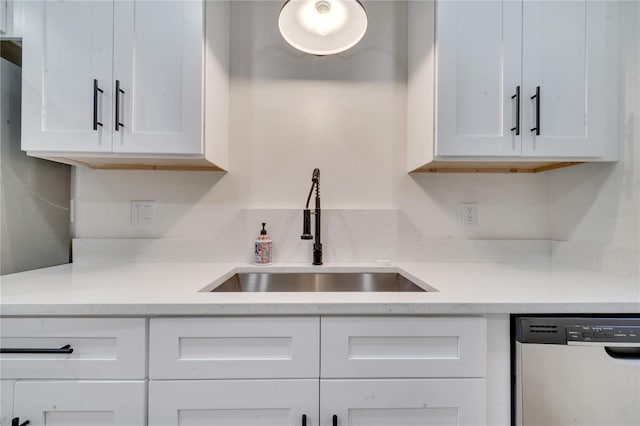 kitchen featuring sink, white cabinets, and stainless steel dishwasher