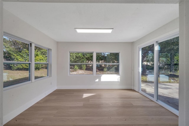 unfurnished sunroom featuring a wealth of natural light