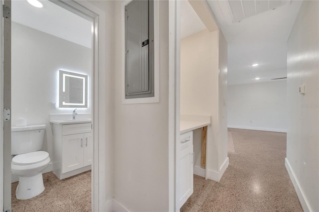 interior space featuring vanity and toilet