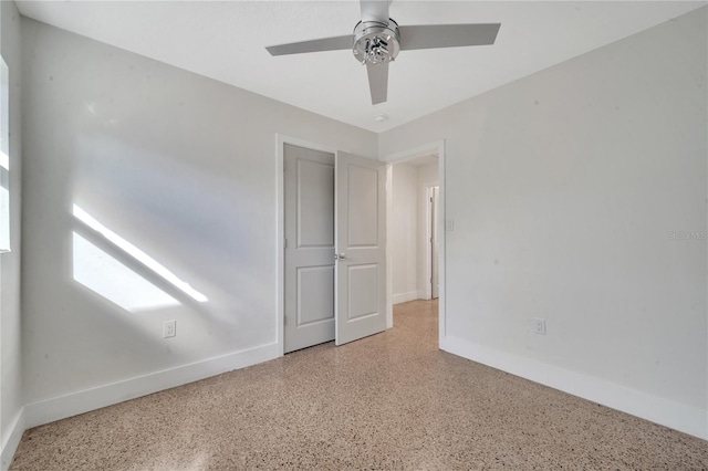 unfurnished room with ceiling fan