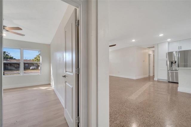 hall featuring vaulted ceiling