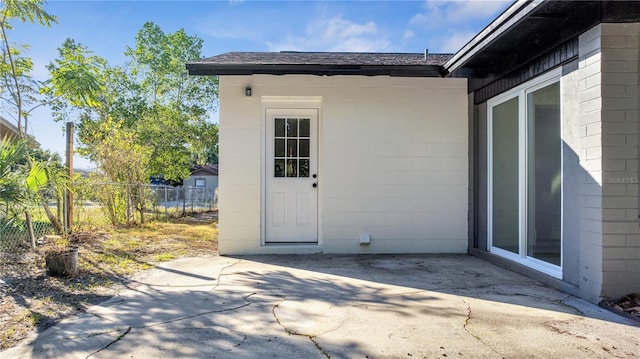 entrance to property with a patio area