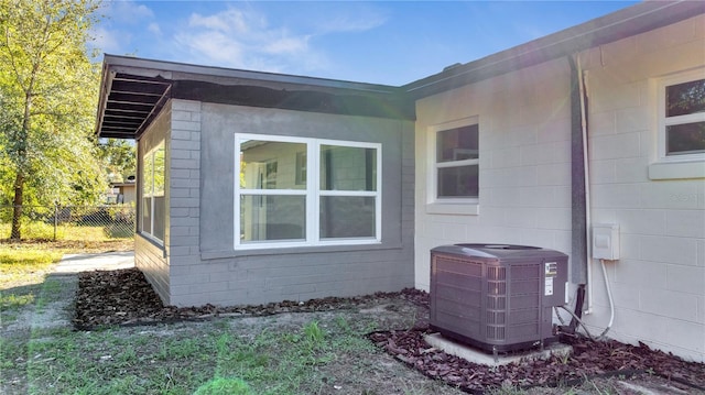 view of side of property with central AC unit