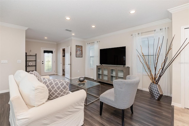 living room featuring hardwood / wood-style flooring and ornamental molding