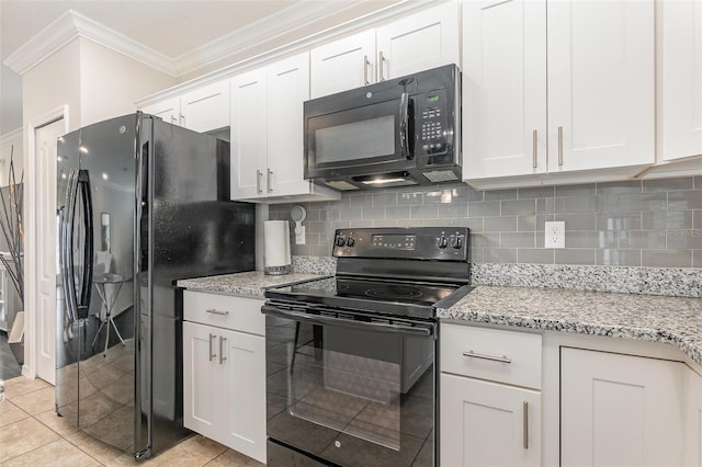 kitchen featuring white cabinets, light tile patterned floors, light stone countertops, and black appliances