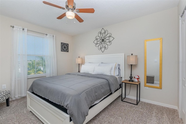 bedroom with light colored carpet and ceiling fan