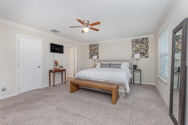 carpeted bedroom featuring ceiling fan and ornamental molding