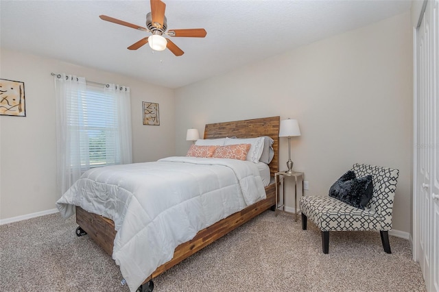 bedroom featuring light colored carpet and ceiling fan