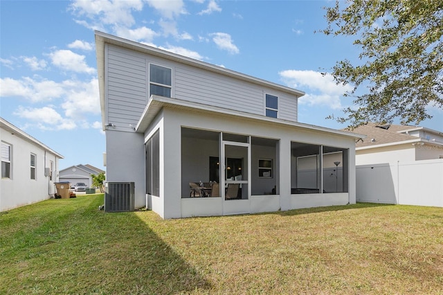 back of property with a yard, central AC, and a sunroom