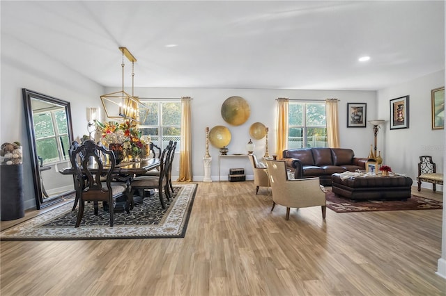 dining room featuring light hardwood / wood-style floors and an inviting chandelier