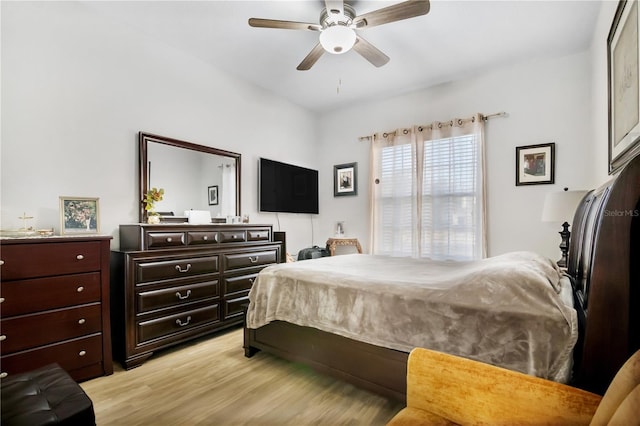 bedroom with ceiling fan and light hardwood / wood-style floors