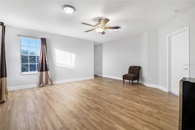 unfurnished room with ceiling fan and light hardwood / wood-style floors