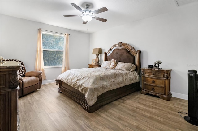 bedroom featuring hardwood / wood-style floors and ceiling fan