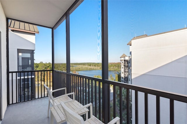 balcony featuring a water view