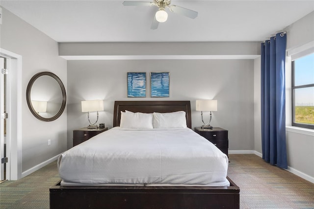 bedroom featuring a ceiling fan, baseboards, and carpet floors